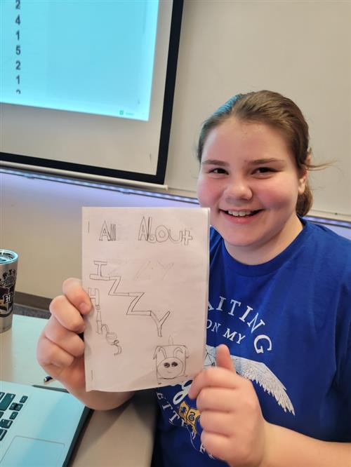 Student showing her textbook